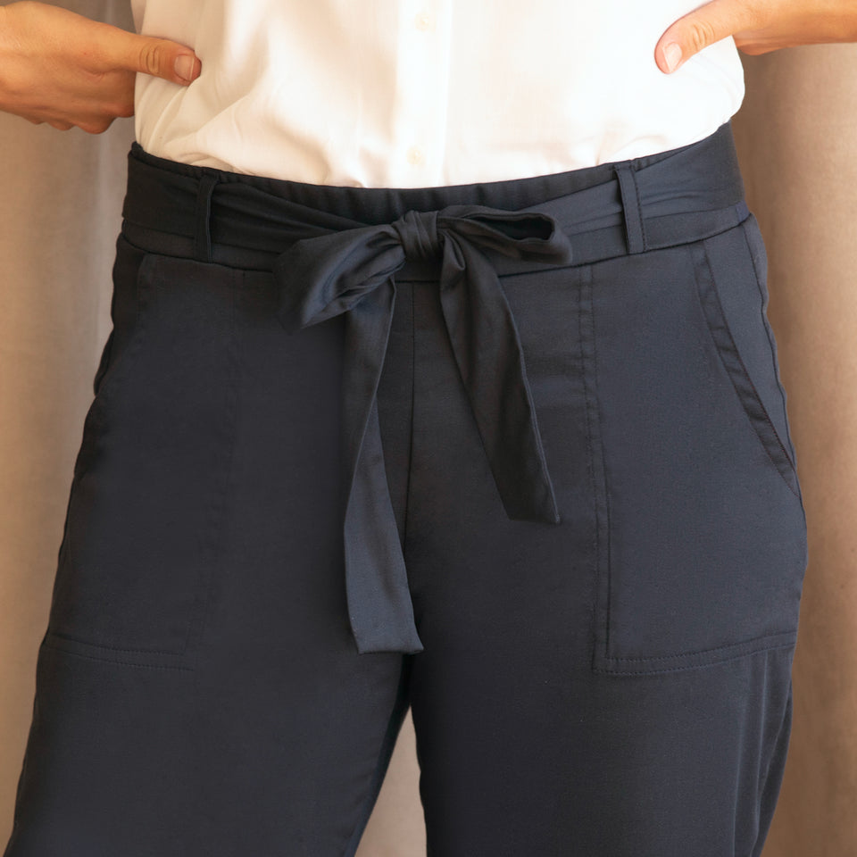 Personalize your style with belt loops, a tie sash belt, and pockets.